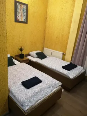 Łóżko lub łóżka w pokoju w obiekcie Gościniec Głuchołazy Zdrój