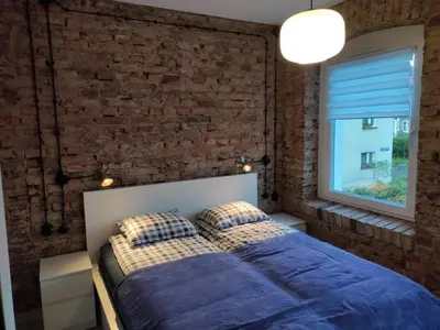 Łóżko lub łóżka w pokoju w obiekcie Apartament Loftowy Głuszyca
