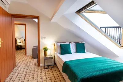 Łóżko lub łóżka w pokoju w obiekcie Hotel Verde Montana Wellness & Spa