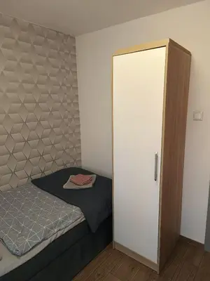 Łóżko lub łóżka w pokoju w obiekcie Apartament Japko