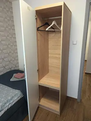 Łóżko lub łóżka w pokoju w obiekcie Apartament Japko