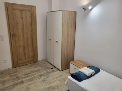 Łóżko lub łóżka w pokoju w obiekcie Noclegi Między Parkami