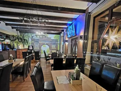 Telewizja i/lub zestaw kina domowego w obiekcie Noclegi Między Parkami