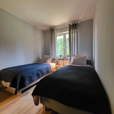 Łóżko lub łóżka w pokoju w obiekcie Apartament Vincent