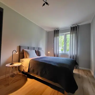 Łóżko lub łóżka w pokoju w obiekcie Apartament Vincent