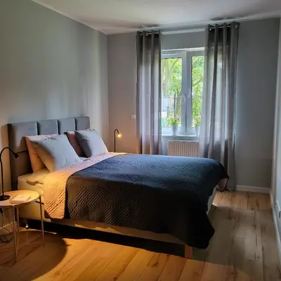 Łóżko lub łóżka w pokoju w obiekcie Apartament Vincent