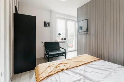 Łóżko lub łóżka w pokoju w obiekcie Nocosfera Apartament Górnośląski