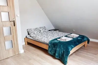 Łóżko lub łóżka w pokoju w obiekcie Apartament ZŁOTE GÓRY - Stronie Śląskie
