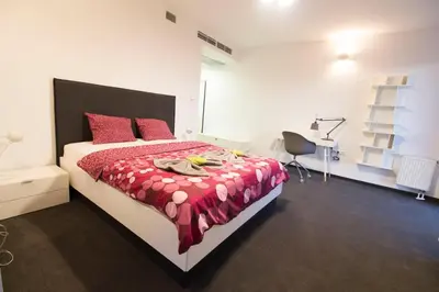Łóżko lub łóżka w pokoju w obiekcie Happy Estate Apartments - Trakt Kupiecki