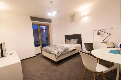 Łóżko lub łóżka w pokoju w obiekcie Happy Estate Apartments - Trakt Kupiecki