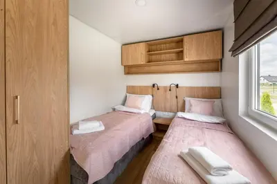 Łóżko lub łóżka w pokoju w obiekcie Wichrowe Wzgórze Lark House