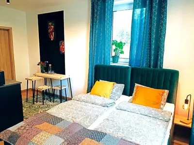 Łóżko lub łóżka w pokoju w obiekcie Apartamenty Zakładowa