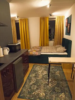 Łóżko lub łóżka w pokoju w obiekcie Apartamenty Zakładowa
