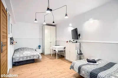 Łóżko lub łóżka w pokoju w obiekcie Studio LUX Gaj by Apartamenty na dni Wrocław