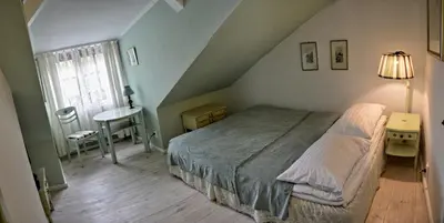 Łóżko lub łóżka w pokoju w obiekcie Karczma Rzym