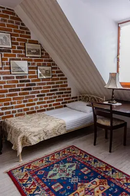 Łóżko lub łóżka w pokoju w obiekcie Karczma Rzym