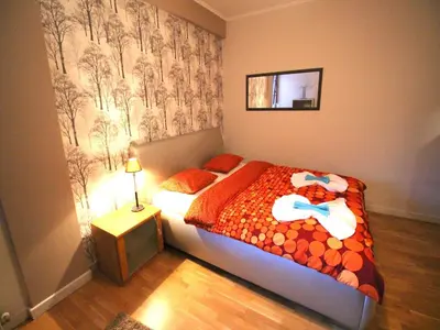 Łóżko lub łóżka w pokoju w obiekcie Happy Apartments Old Town