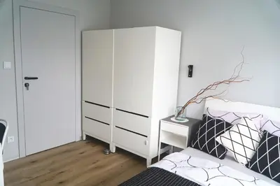 Łóżko lub łóżka w pokoju w obiekcie Piękny apartament w zielonej dzielnicy Wrocławia