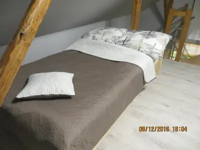 Łóżko lub łóżka w pokoju w obiekcie Noclegi U Andrzeja