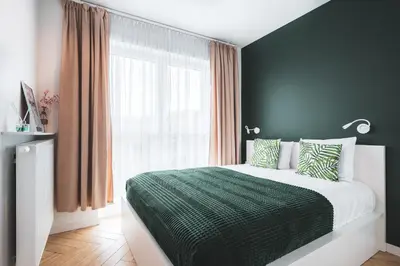 Łóżko lub łóżka w pokoju w obiekcie Pure Rental Apartments Inżynierska - Parking Free