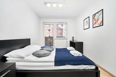 Łóżko lub łóżka w pokoju w obiekcie Apartament Spiżowa z Balkonem Wrocław by Noclegi Renters