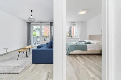 Łóżko lub łóżka w pokoju w obiekcie Apartment Wrocław Swojczyce by Noclegi Renters