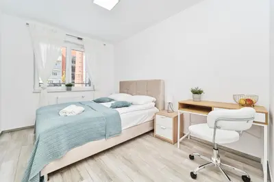 Łóżko lub łóżka w pokoju w obiekcie Apartment Wrocław Swojczyce by Noclegi Renters