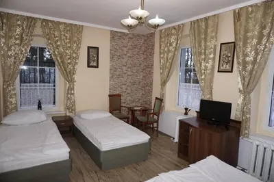 Łóżko lub łóżka w pokoju w obiekcie Willa Dunajec