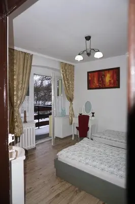 Łóżko lub łóżka w pokoju w obiekcie Willa Dunajec