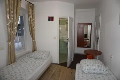 Łóżko lub łóżka w pokoju w obiekcie Willa Dunajec