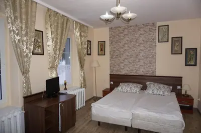 Łóżko lub łóżka w pokoju w obiekcie Willa Dunajec