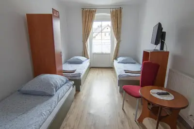 Łóżko lub łóżka w pokoju w obiekcie Willa Dunajec