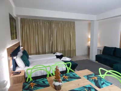Łóżko lub łóżka w pokoju w obiekcie AGAT Apartament Czarna Góra