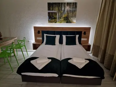 Łóżko lub łóżka w pokoju w obiekcie AGAT Apartament Czarna Góra