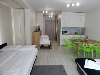 Łóżko lub łóżka w pokoju w obiekcie AGAT Apartament Czarna Góra
