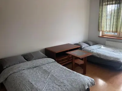 Łóżko lub łóżka w pokoju w obiekcie Blue River - Daszynskiego