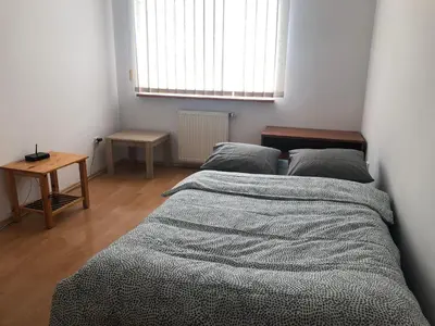 Łóżko lub łóżka w pokoju w obiekcie Blue River - Daszynskiego