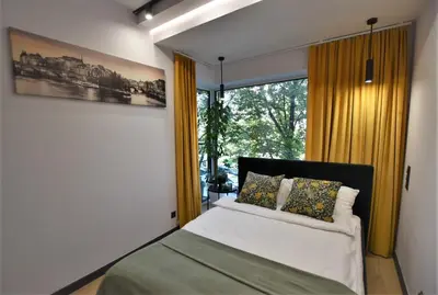Łóżko lub łóżka w pokoju w obiekcie Green Apartament City Center