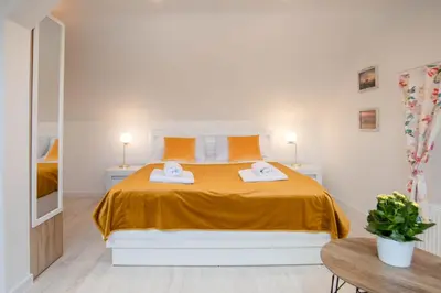 Łóżko lub łóżka w pokoju w obiekcie Apartament Petunia