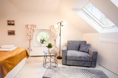 Łóżko lub łóżka w pokoju w obiekcie Apartament Petunia
