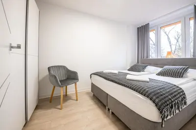 Łóżko lub łóżka w pokoju w obiekcie Apartament26