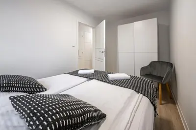Łóżko lub łóżka w pokoju w obiekcie Apartament26