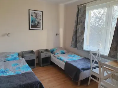 Łóżko lub łóżka w pokoju w obiekcie Pokoje Babie Lato
