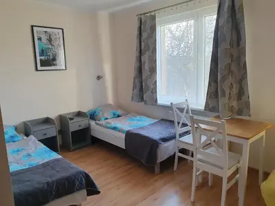Łóżko lub łóżka w pokoju w obiekcie Pokoje Babie Lato