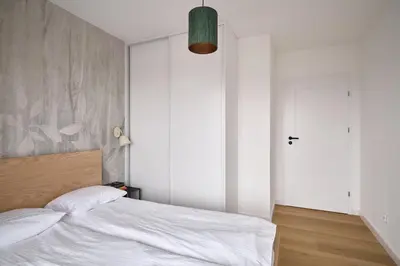 Łóżko lub łóżka w pokoju w obiekcie Apartamenty niedaleko dworca od WroclawApartament-pl
