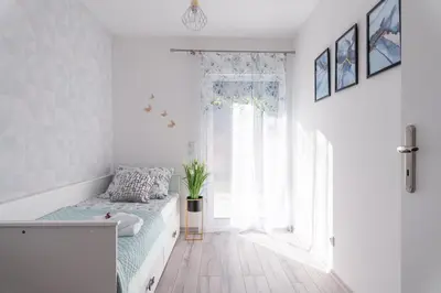 Łóżko lub łóżka w pokoju w obiekcie Apartamenty Pod Cisem Lux