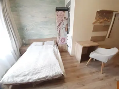 Łóżko lub łóżka w pokoju w obiekcie Pokoje Za Kinem