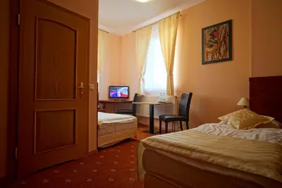 Łóżko lub łóżka w pokoju w obiekcie Noclegi w Lublińcu Lubex