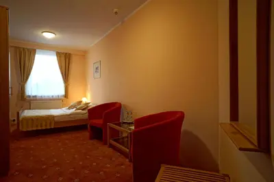 Łóżko lub łóżka w pokoju w obiekcie Noclegi w Lublińcu Lubex