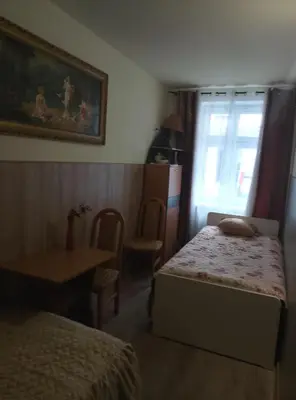 Łóżko lub łóżka w pokoju w obiekcie Hostel CION